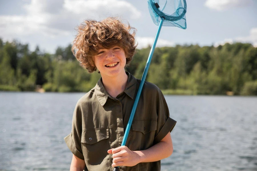 Portrait of Smiling Boy Holding Net