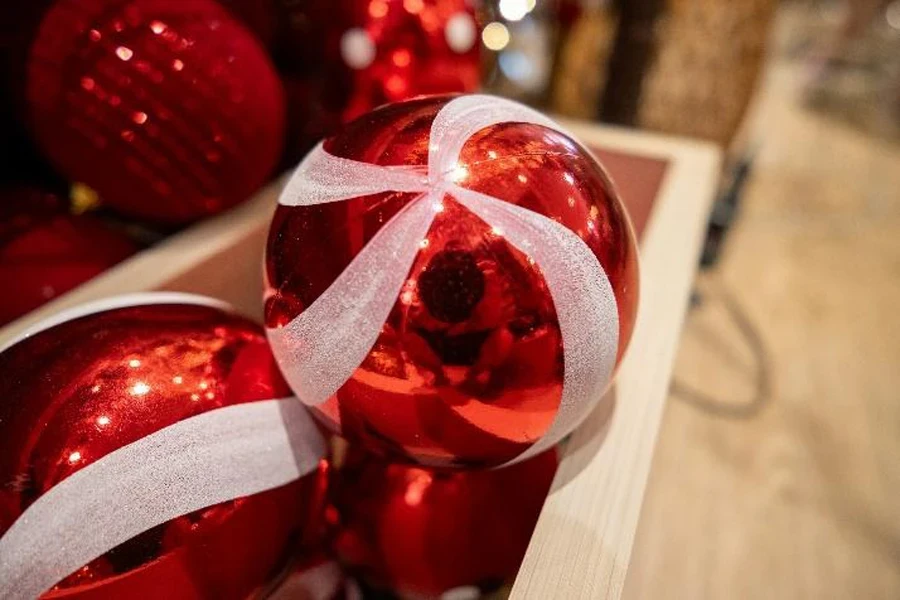 Red Christmas ornament with white ribbon