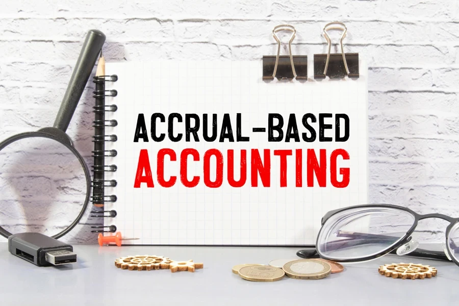 The words “Accrual-based accounting” on a notebook