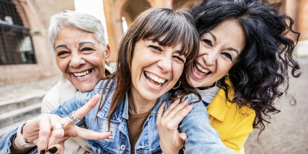 Three Gen X women having fun together