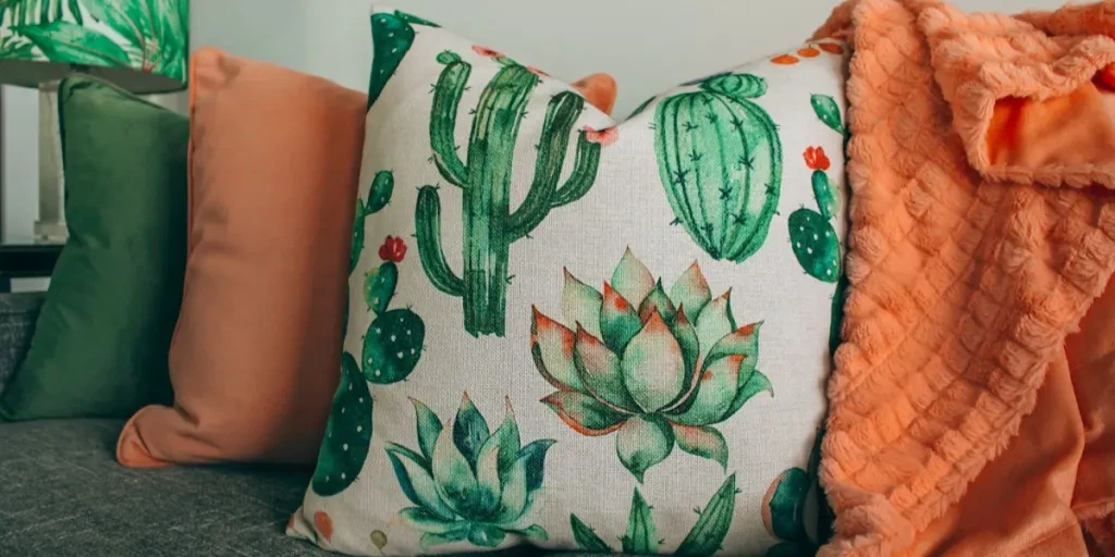 Throw pillow with illustrated cactus print