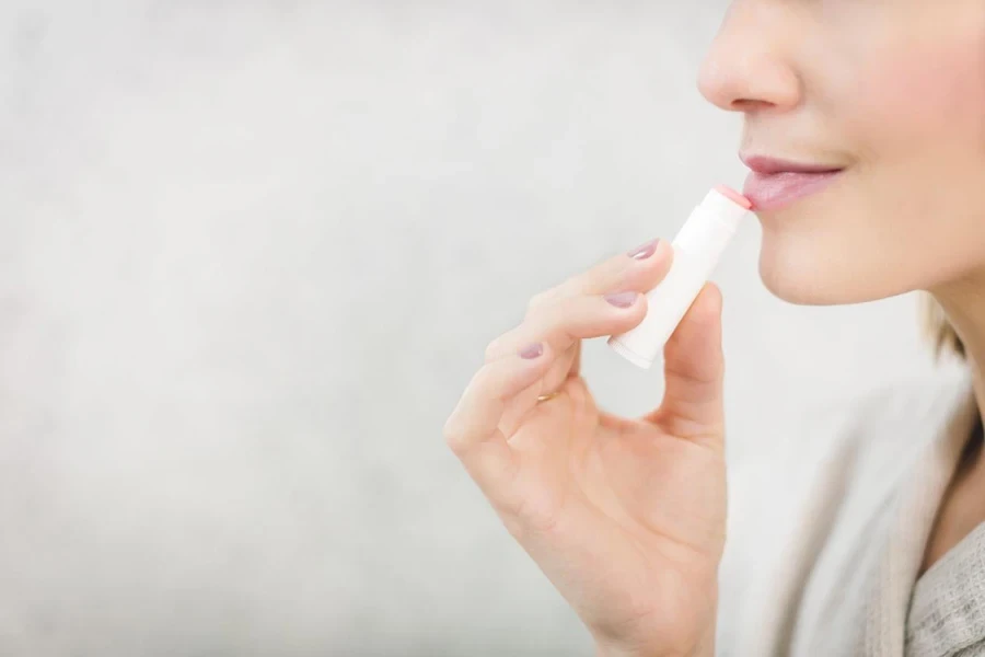 Woman Using Lip Balm