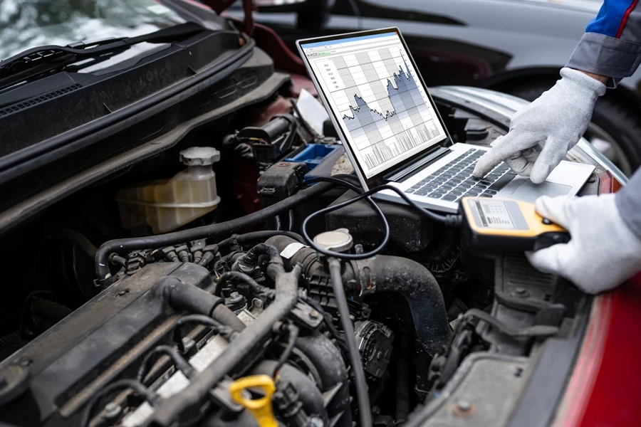 car mechanic checking vehicle parameters