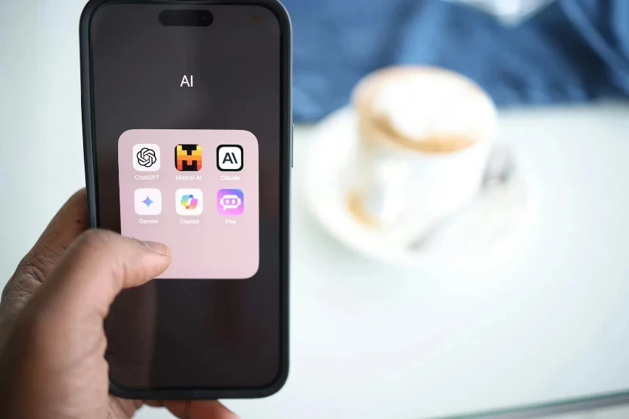 person holding a phone showing different AI tools