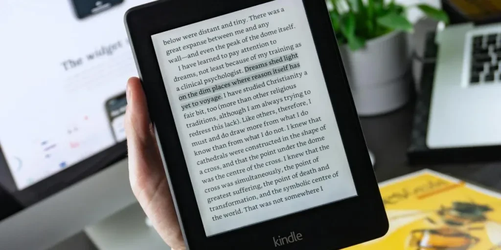 person reading an e-book on a Kindle