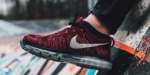 Close-Up Photography of Red and Black Nike Running Shoe