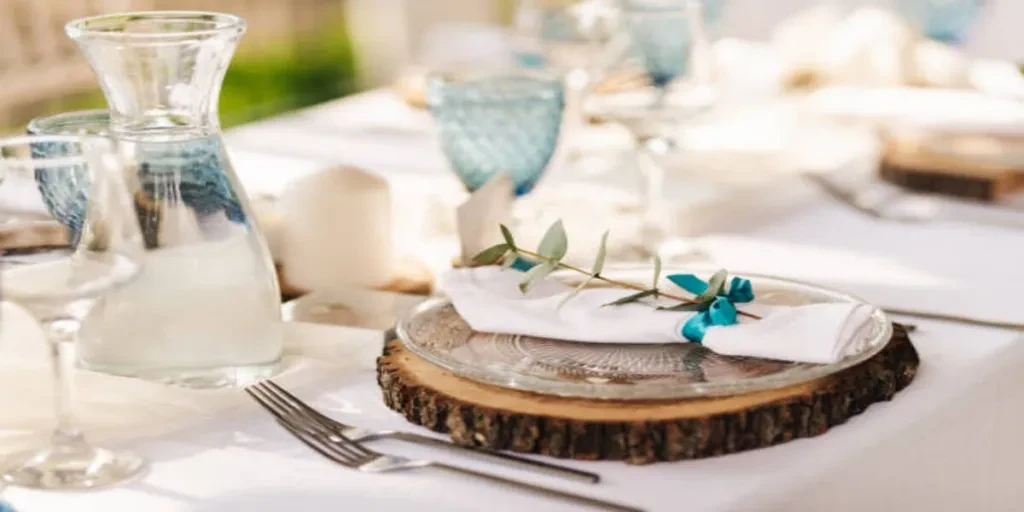 Service plates made from wood on wedding table