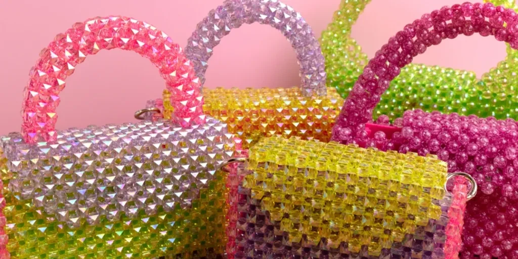 Multicoloured beaded bags on a table