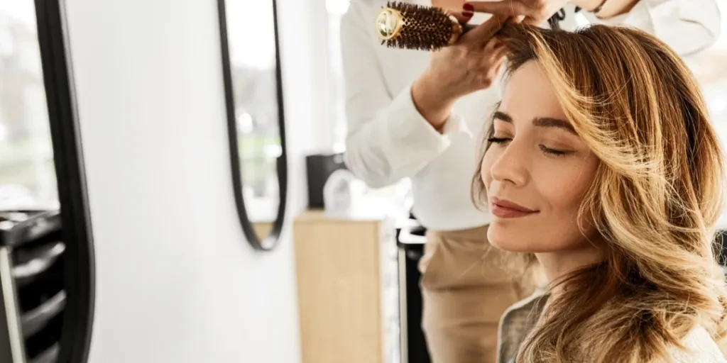 Woman getting a haircut at a salon