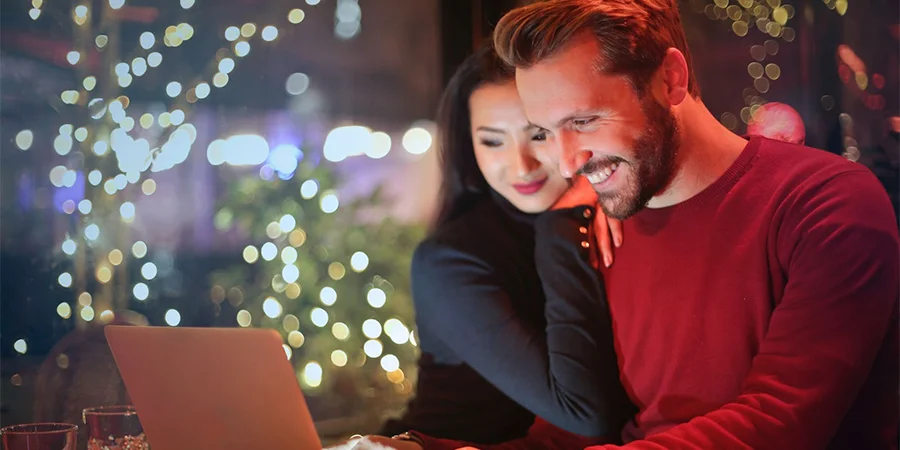 Couple shopping online during Christmas holiday