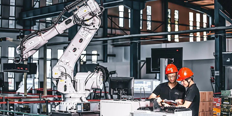 Workers and smart machine at work at an operating plant