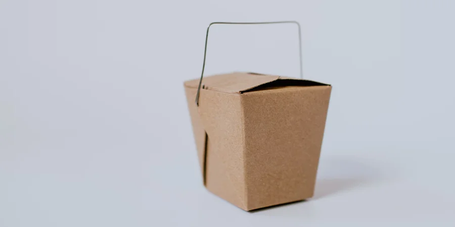 Small brown cardboard takeout box with handle