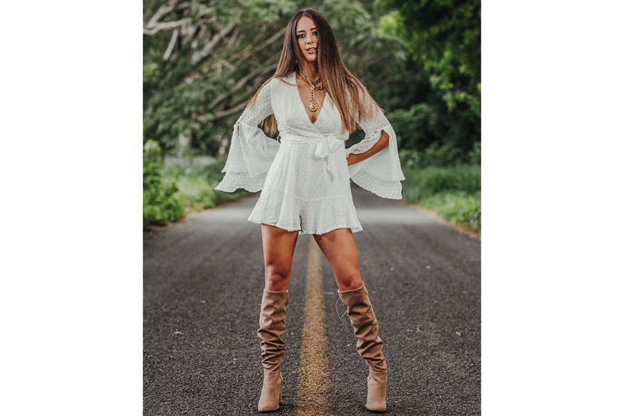A woman wearing a white mini dress
