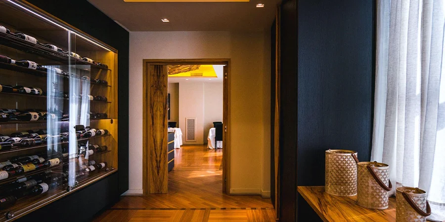 Modern home interior in dark colors with wood vinyl flooring
