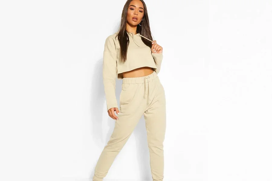 Beautiful lady in two-piece crop-top and tracksuit