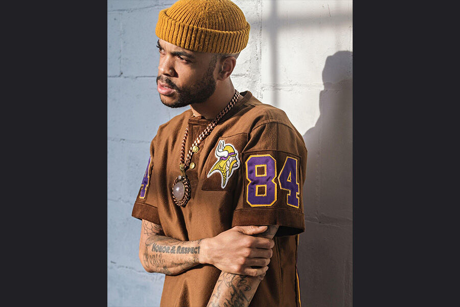 A man wearing a brown t-shirt