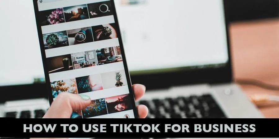 Anonymous hand holding smartphone with TikTok app