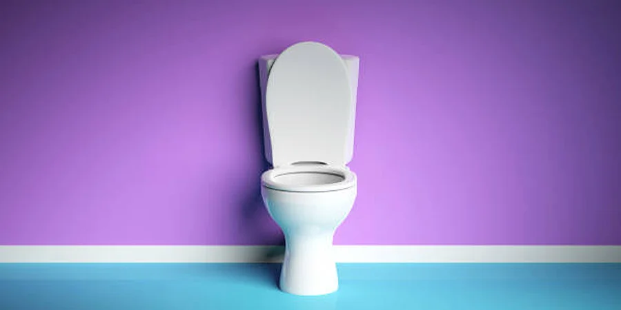 White toilet with seat up against purple and blue backdrop