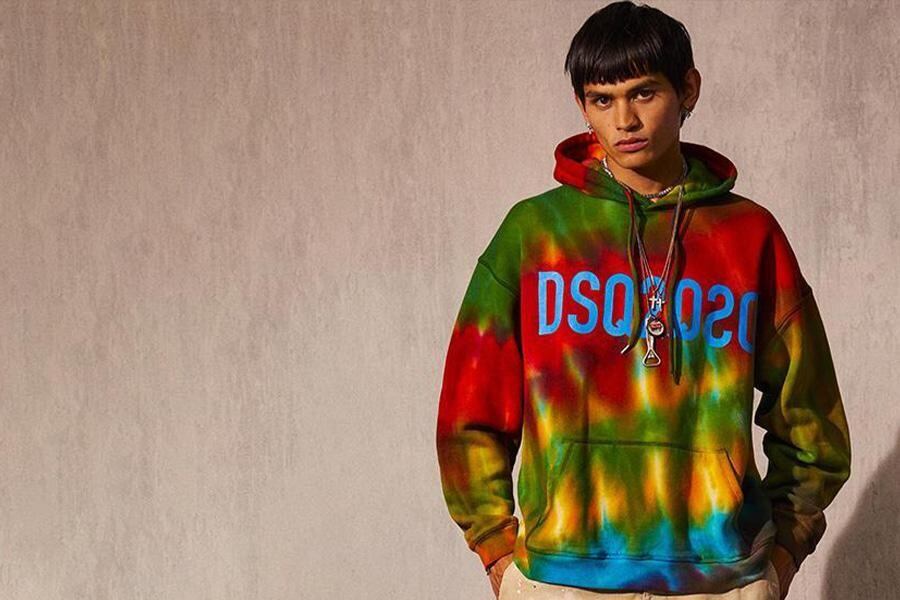 A man wearing a multicolored hoodie