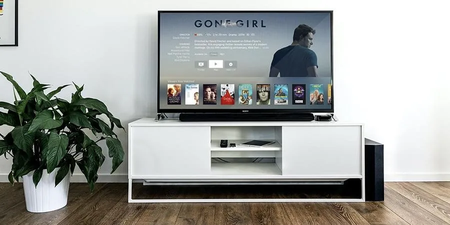 A TV stand with a smart TV on it