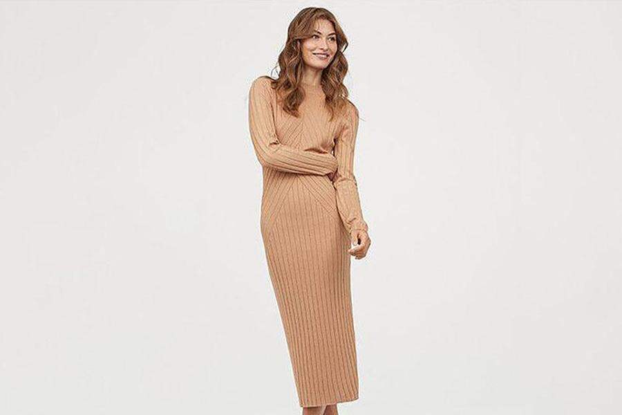 A woman in a knitted long dress