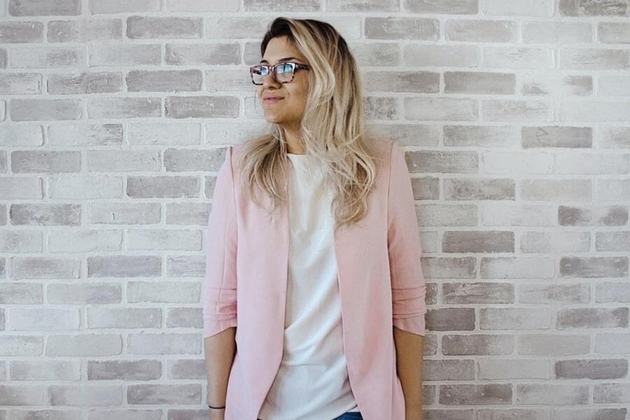 Lady wearing a pink business-casual blazer