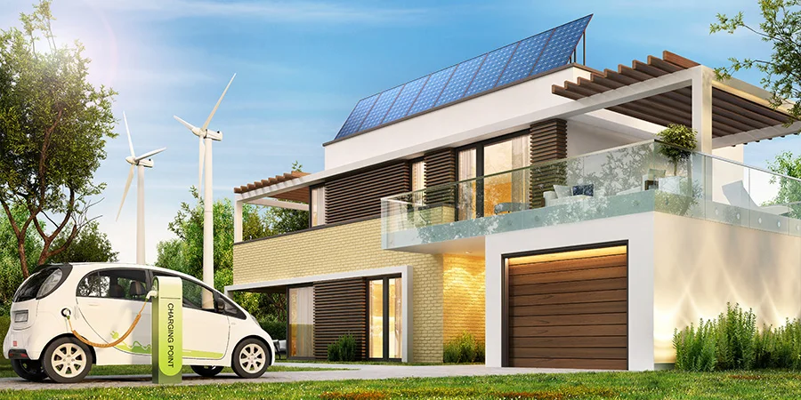 Modern eco house with solar panels and wind turbines and an electric car. Solar panels on the roof of the house
