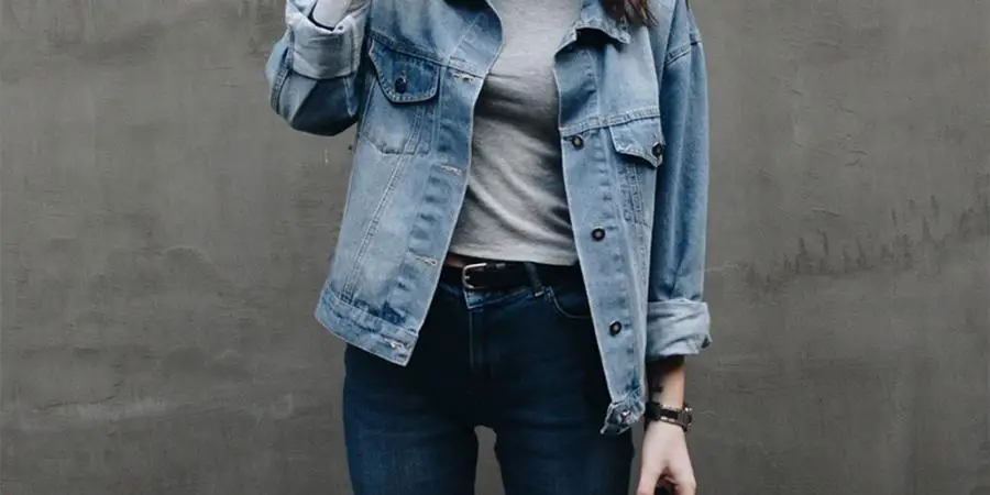 Woman wearing denim jacket and jeans