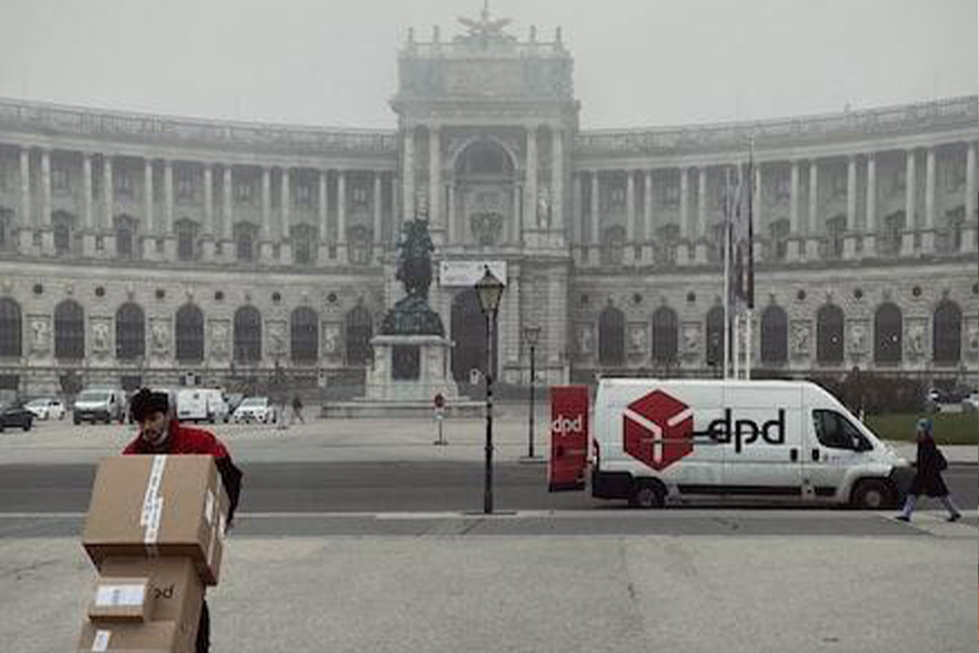 courier delivering small shipments from a van