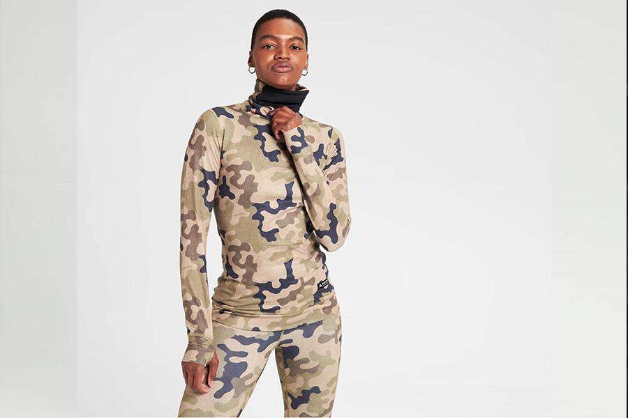 Lady wearing camo-styled base layer top and pants