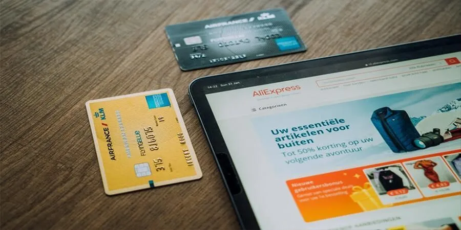Screen showing AliExpress and two payment cards