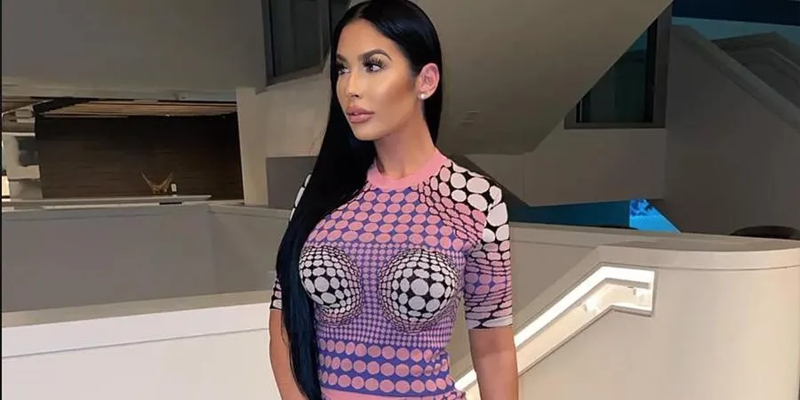Woman wearing a pink print-designed body suit