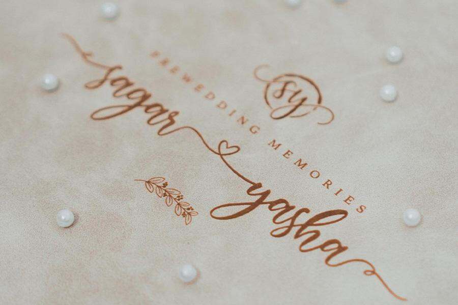 A person holding a wedding photo album