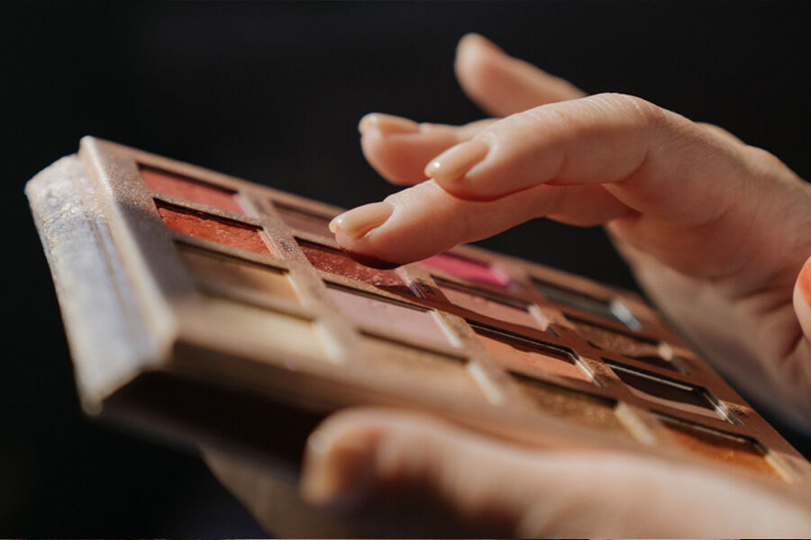 A range of luster eyeshadow applied with a finger”