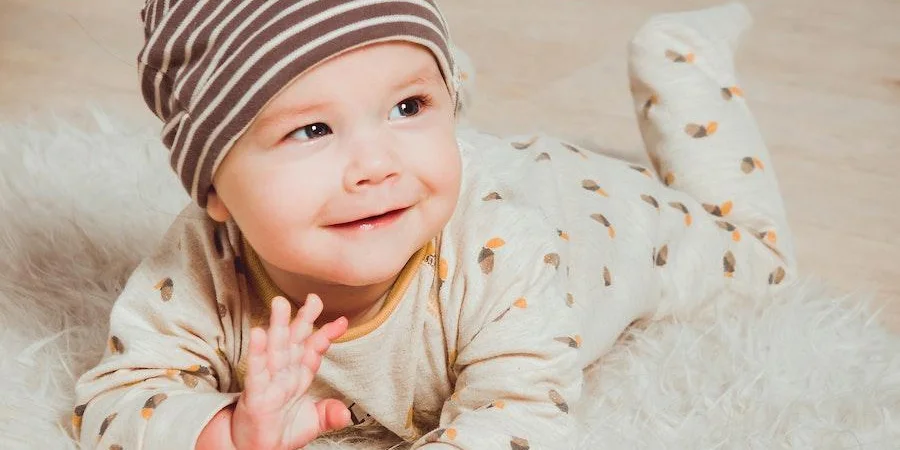 Baby smiling in comfortable childrenswear