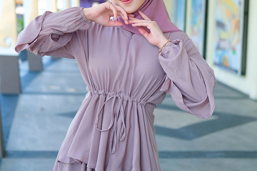 Hijab woman rocking a purple adjustable dress