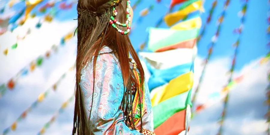 Woman wearing colorful clothes at a festival