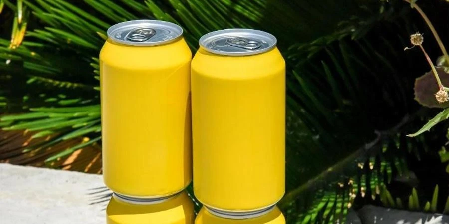 Yellow soft drink beverage cans