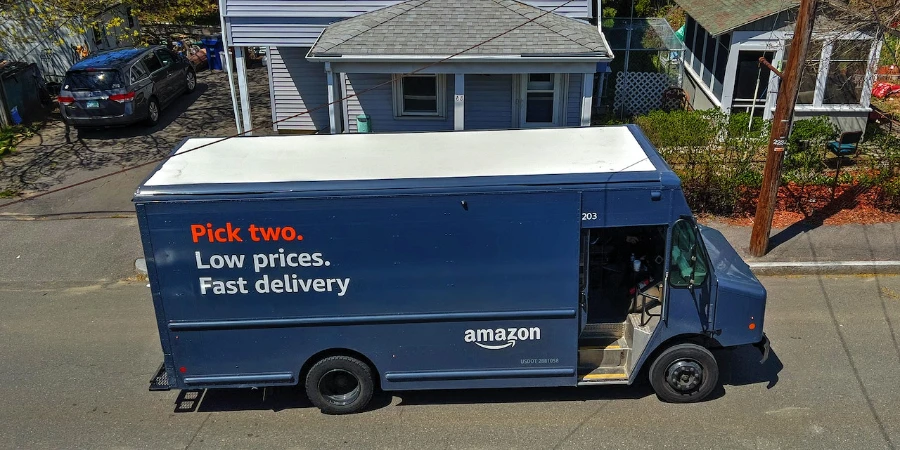 An Amazon delivery van parked in front of a house