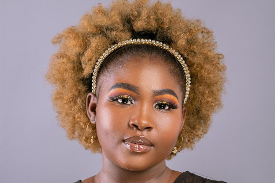 Black woman rocking an embellished pearl headband