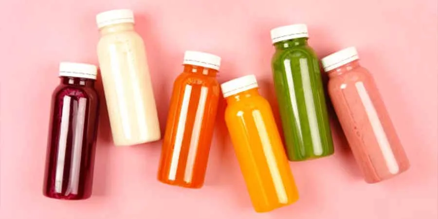 Different flavors of juices inside plastic bottles with screw cap
