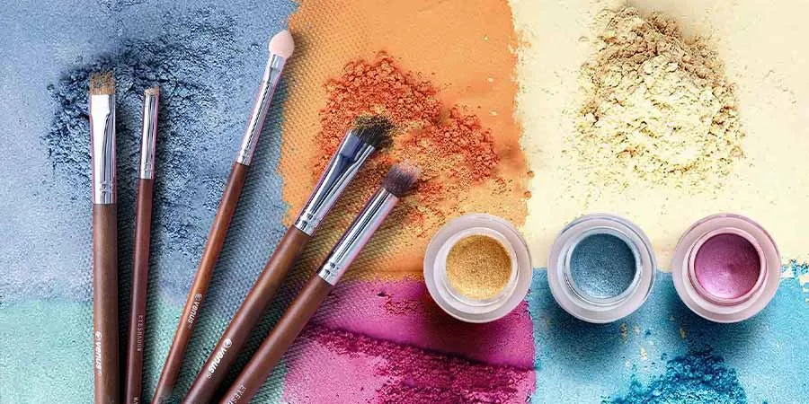 Eye pigments and brush: women wearing makeup