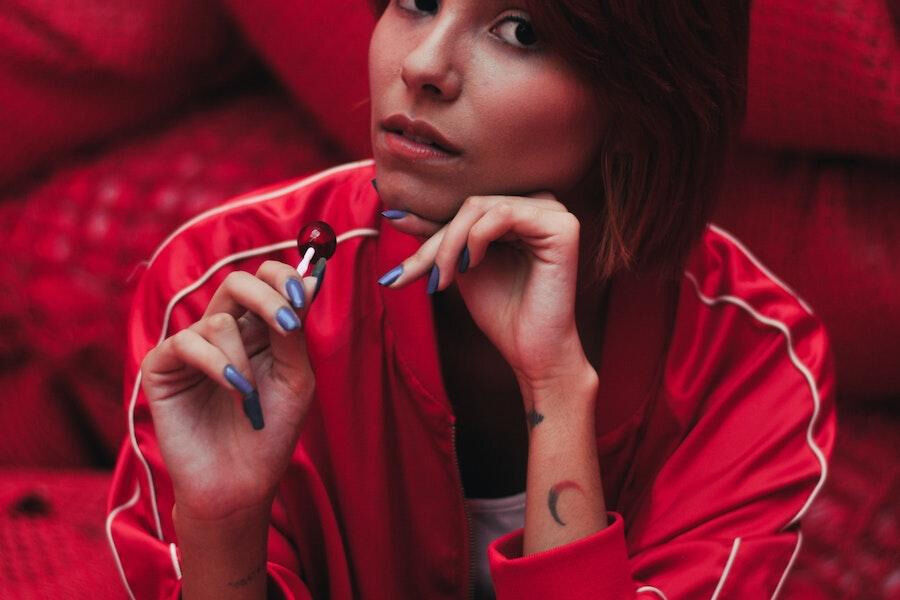 woman wearing red activewear jacket