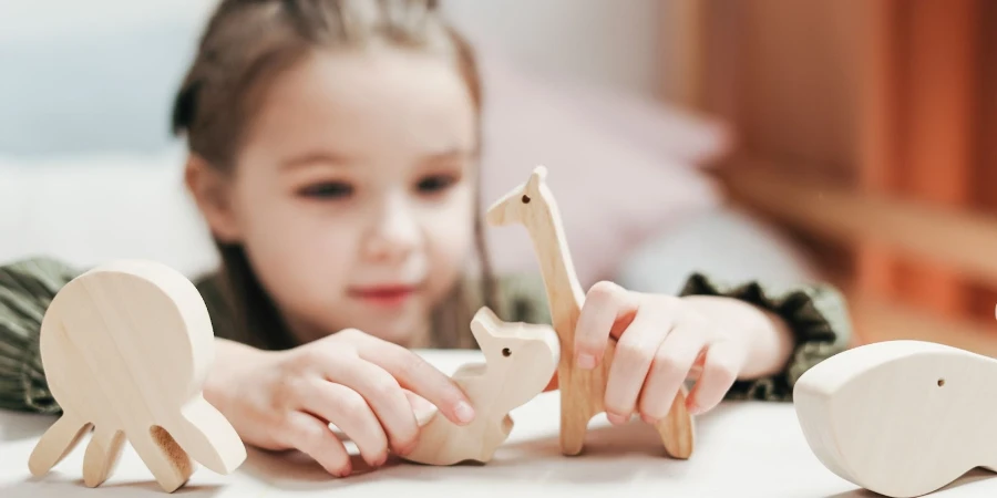A girl playing with wooden toys