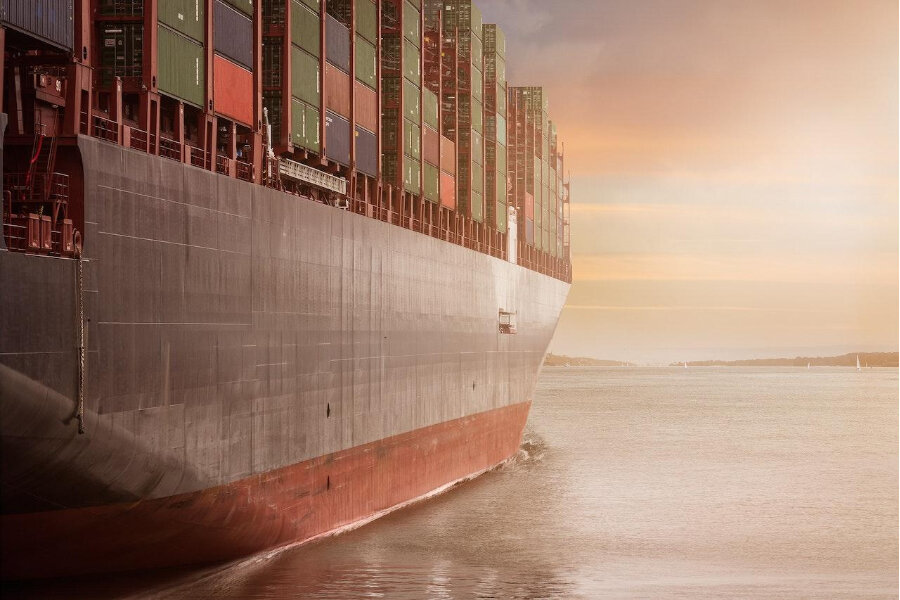 Boat holding containers in the body of water