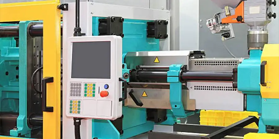 Close-up of an injection molding machine for plastic parts production
