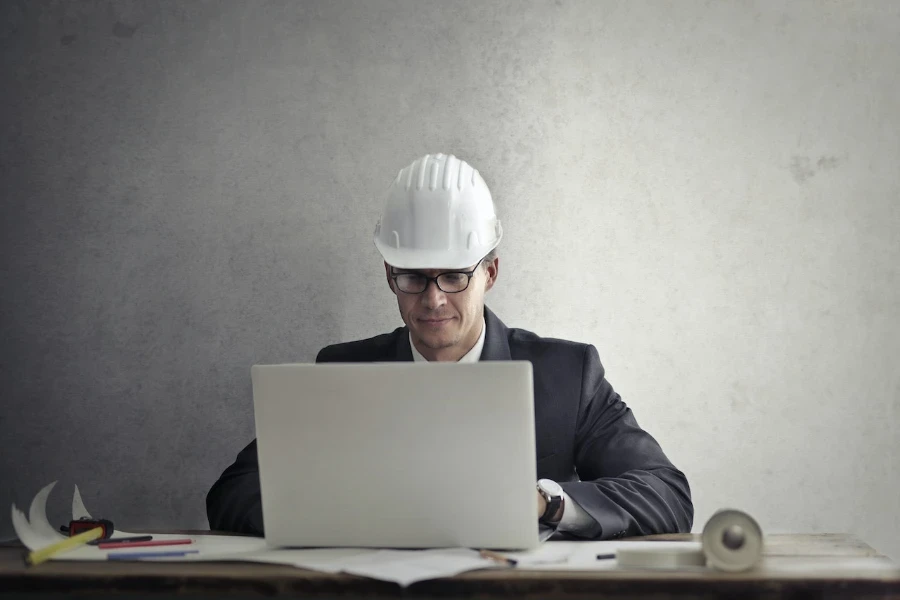 Engineer working with a laptop on a table