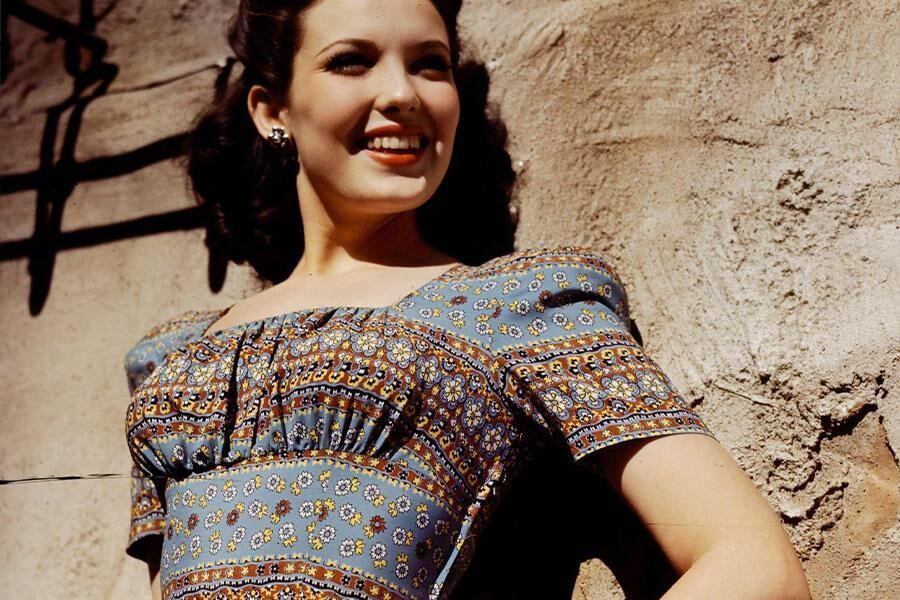 Woman with vintage style wearing a colorful bohemian dress