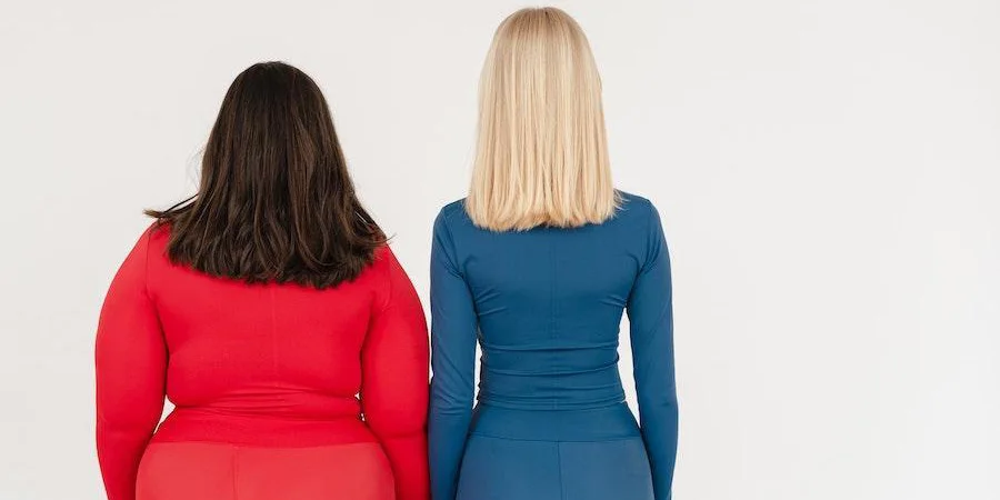 women wearing blue and red outfits while facing back