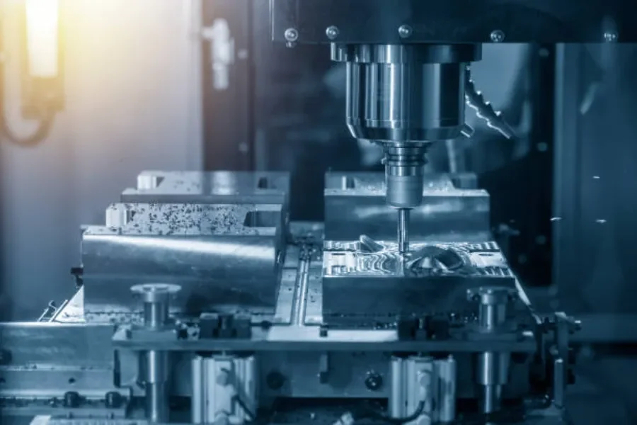 A CNC milling machine cutting injection mold parts